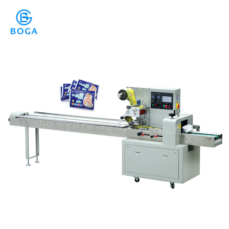 Quality High speed sanitary napkin baby diaper facial tissue paper roll wrapping packing machine for sale