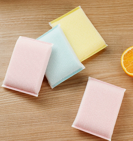 Double sided sponge scrubber showing both soft and rough surfaces
