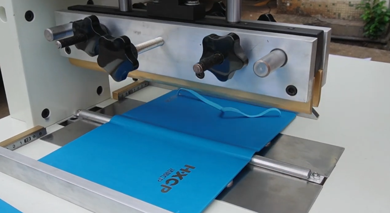 HX700CBR Hardcover Case Back Rounding Machine pneumatically rounds spines with heated molds and easy manual feeding