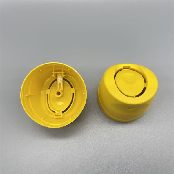 Aerosol spray cap ergonomic design highlighting finger placement