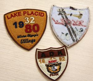 Quality PU Leather Embroidered Custom Sew On Patches RPET Fabric Plain Back. for sale
