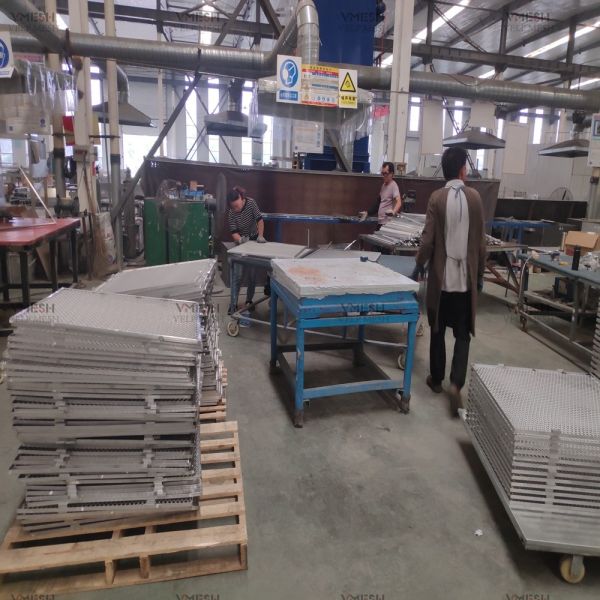 Expanded metal mesh installation in industrial setting