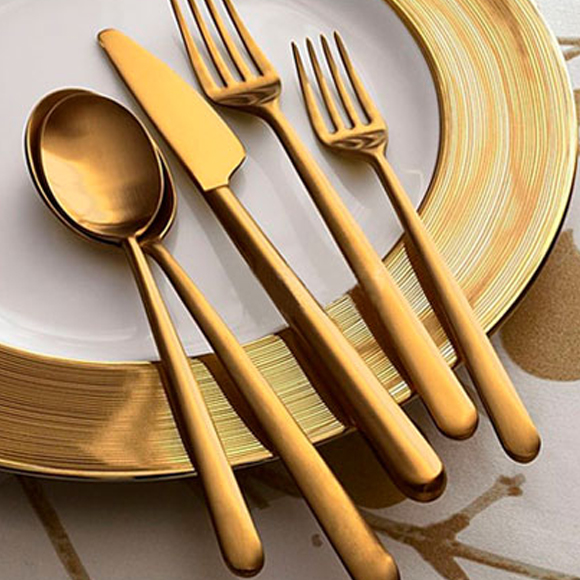 PVD coating machine producing gold IP color finishes on metal components