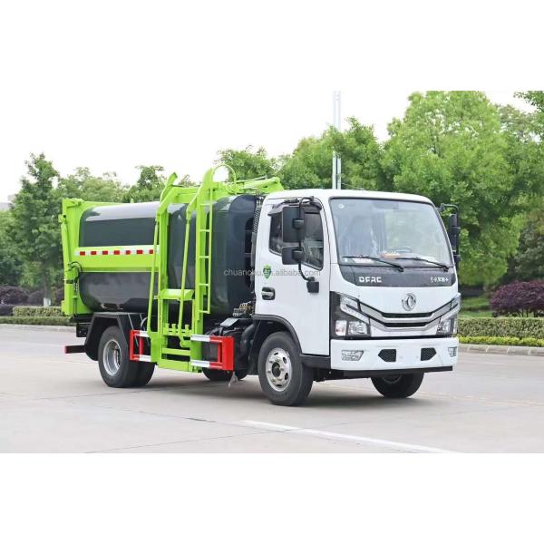Self-loading garbage truck side view