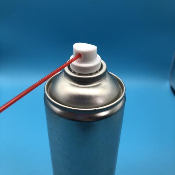 Multiple WD-40 style valves in production line showing manufacturing process