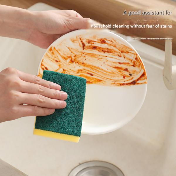 Double-sided kitchen sponge showing sponge and scouring sides
