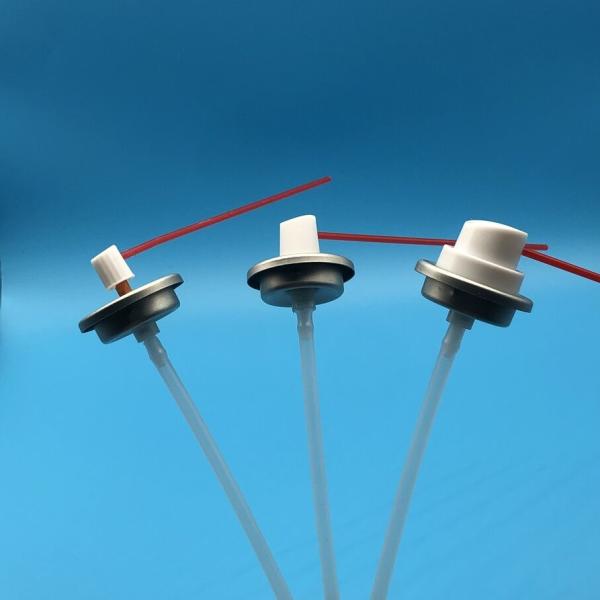 Aerosol valve with straw actuator demonstrating spray functionality
