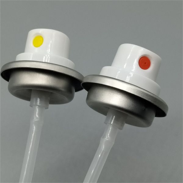 Automotive interior cleaner spray valve in use on dashboard