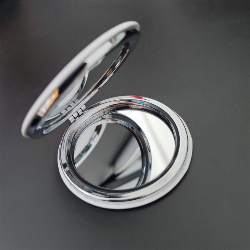 Close-up view of the acrylic mirror showing clear reflection and sturdy metal frame