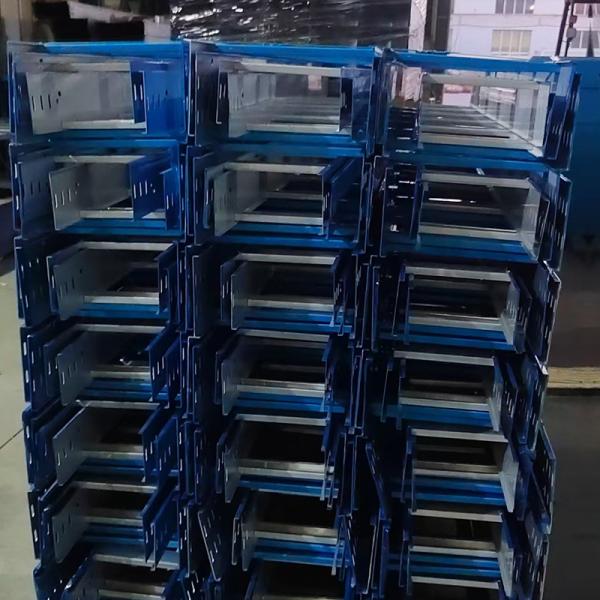 Galvanized metal cable tray mounted on wall showing cable organization