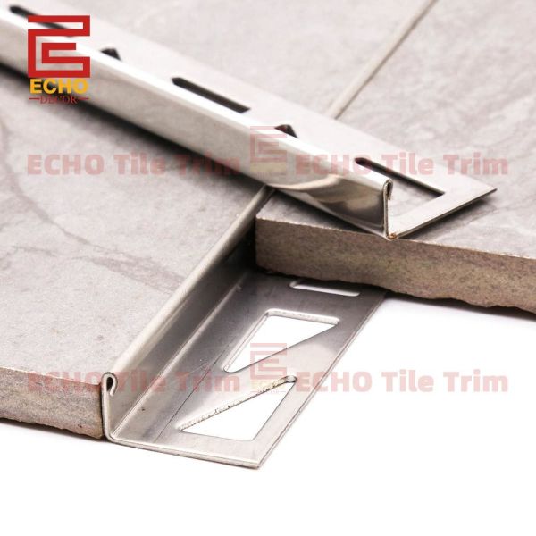 Close-up view of metal straight edge tile trim profile and construction