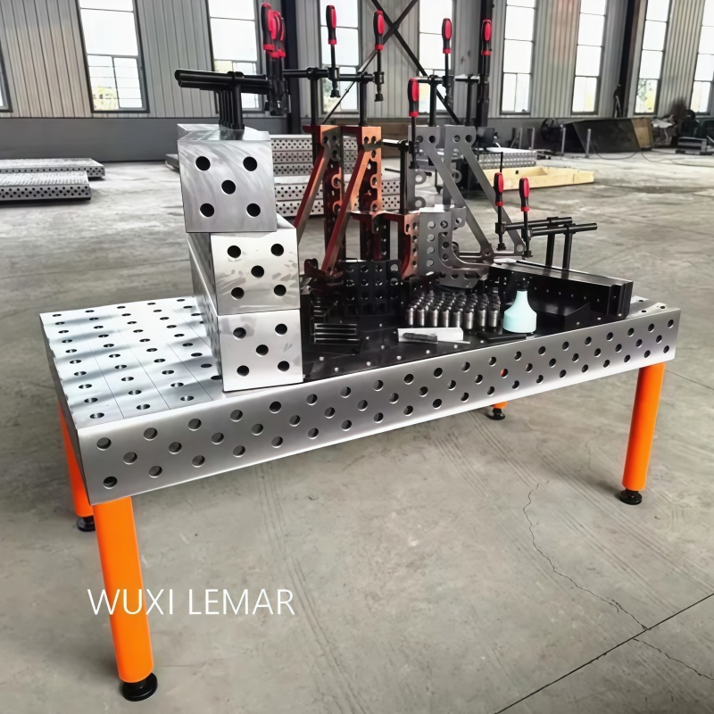 Close-up view of D28 welding table clamping mechanism