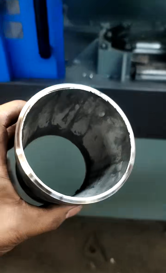 Close-up of pipe chamfering process