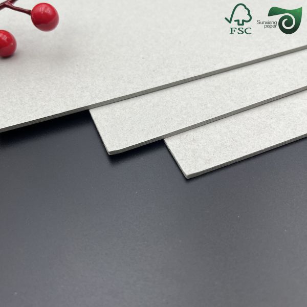 Gray solid cardboard sheet showing smooth surface and uniform texture
