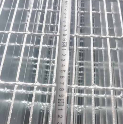Close-up view of welded steel grating surface texture and construction