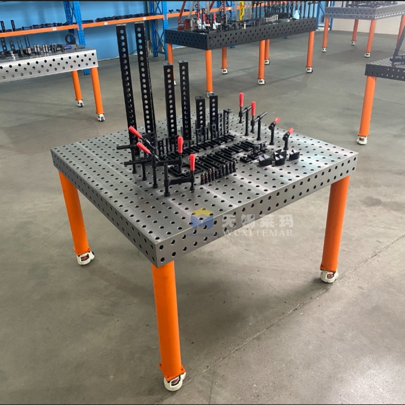 D16 welding table in use with various fixtures