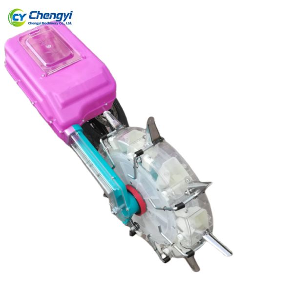Multi-Crop Manual Push Fertilizer in use showing clear view of internal mechanism